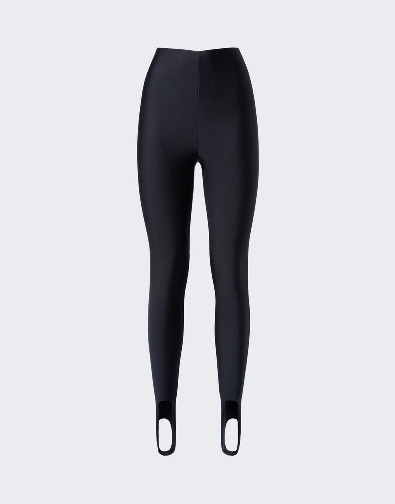 Frontal view of New Holly Stirup Leggings, black shiny full-length stirrup leggings with a very high raw waist and fitted legs ending in foot loops.