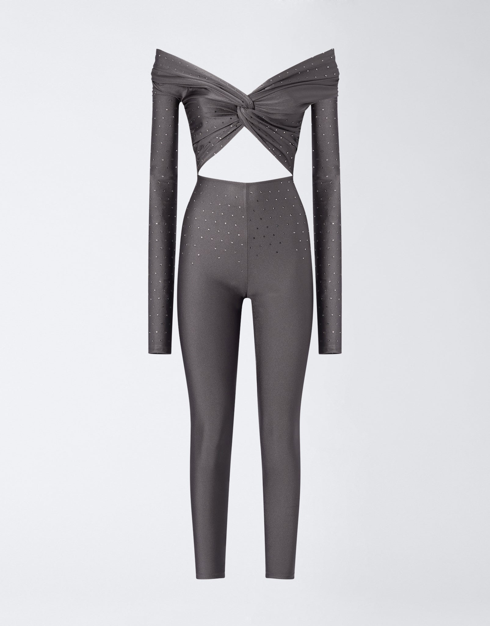 Frontal view shows Kendall Crystal Jumpsuit in ardesia shiny lycra, off-the-shoulder with knot detail, chest cut-out, crystal embellishments, and full-length leggings.