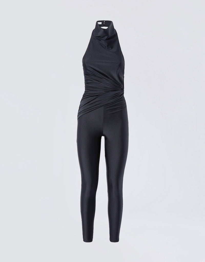 
                          Frontal view of the Tatiana Jumpsuit, a black shiny lycra sleeveless jumpsuit featuring a halterneck, a knot detail at the waist, and full-length leggings.
                        