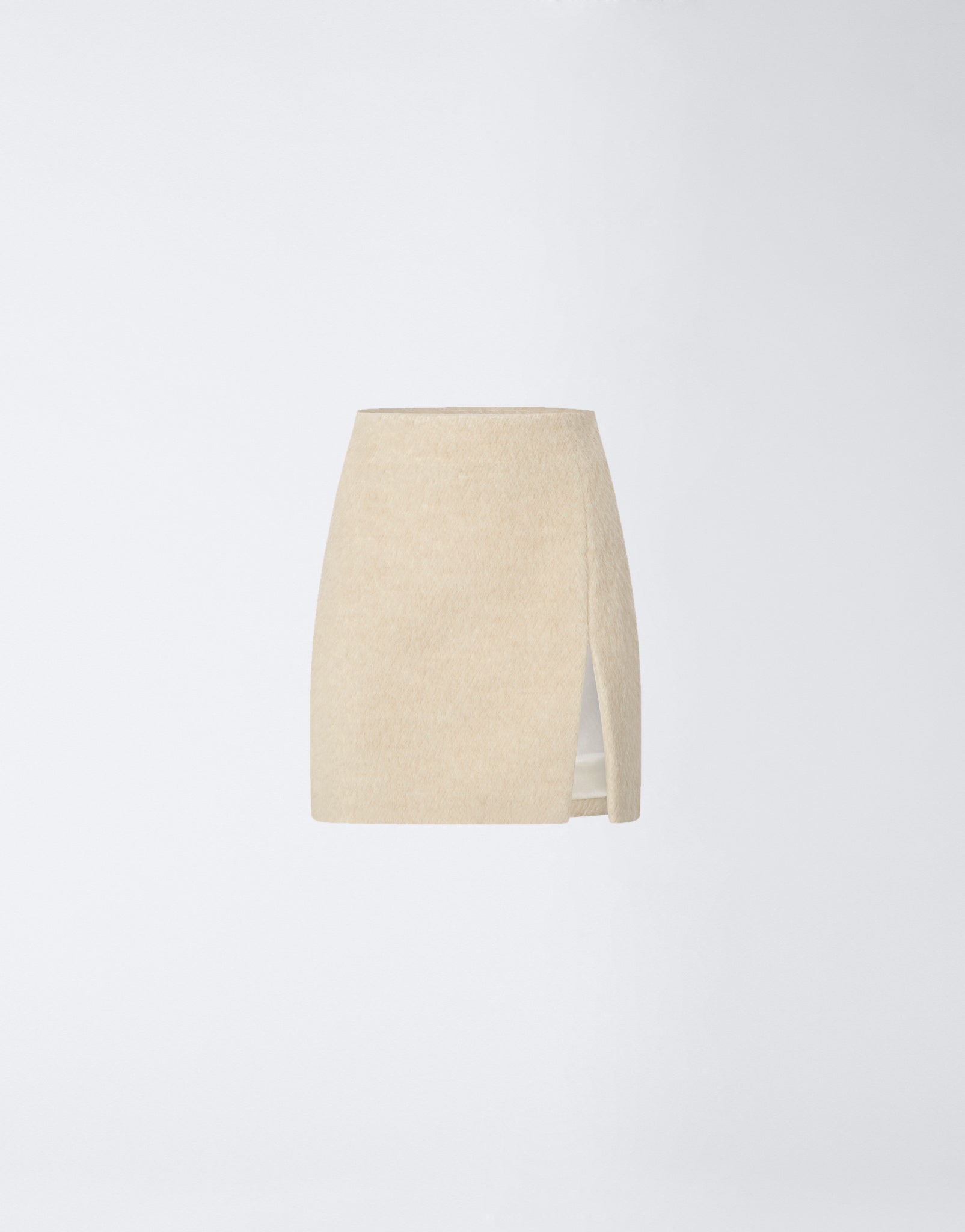 Frontal view of the Gioia Mini Skirt in soft ivory wool twill, featuring a high-waisted fit, side thigh slit, and clean minimalist design.