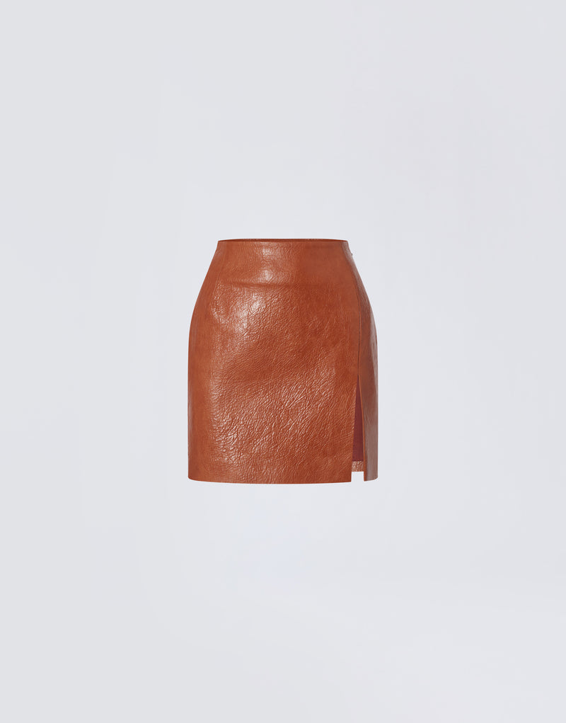 
                          Frontal view shows the Gioia Mini Skirt in cuoio embossed eco leather with high waist, thigh slit, and sleek, structured design.
                        