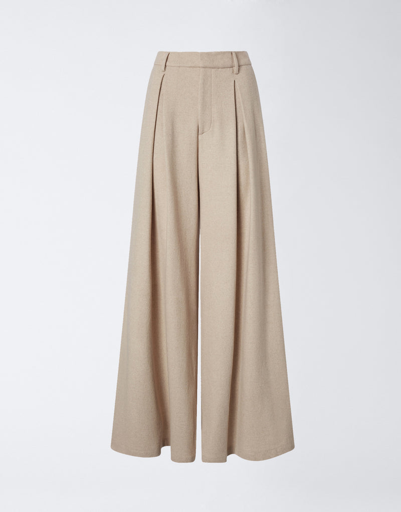 
                          Frontal view of Tara Maxi Pants, featuring super oversized sand-colored soft felted jersey fabric, belt loops, front pleats, and wide legs for a voluminous effect.
                        