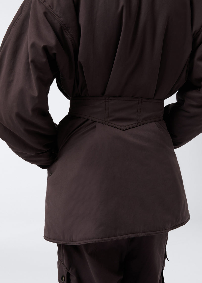 
                          Rear view shows the Xandra Jacket in dark brown suede-touch nylon, highlighting the oversized spread collar, military-inspired belt sewn onto the back, and structured silhouette.
                        