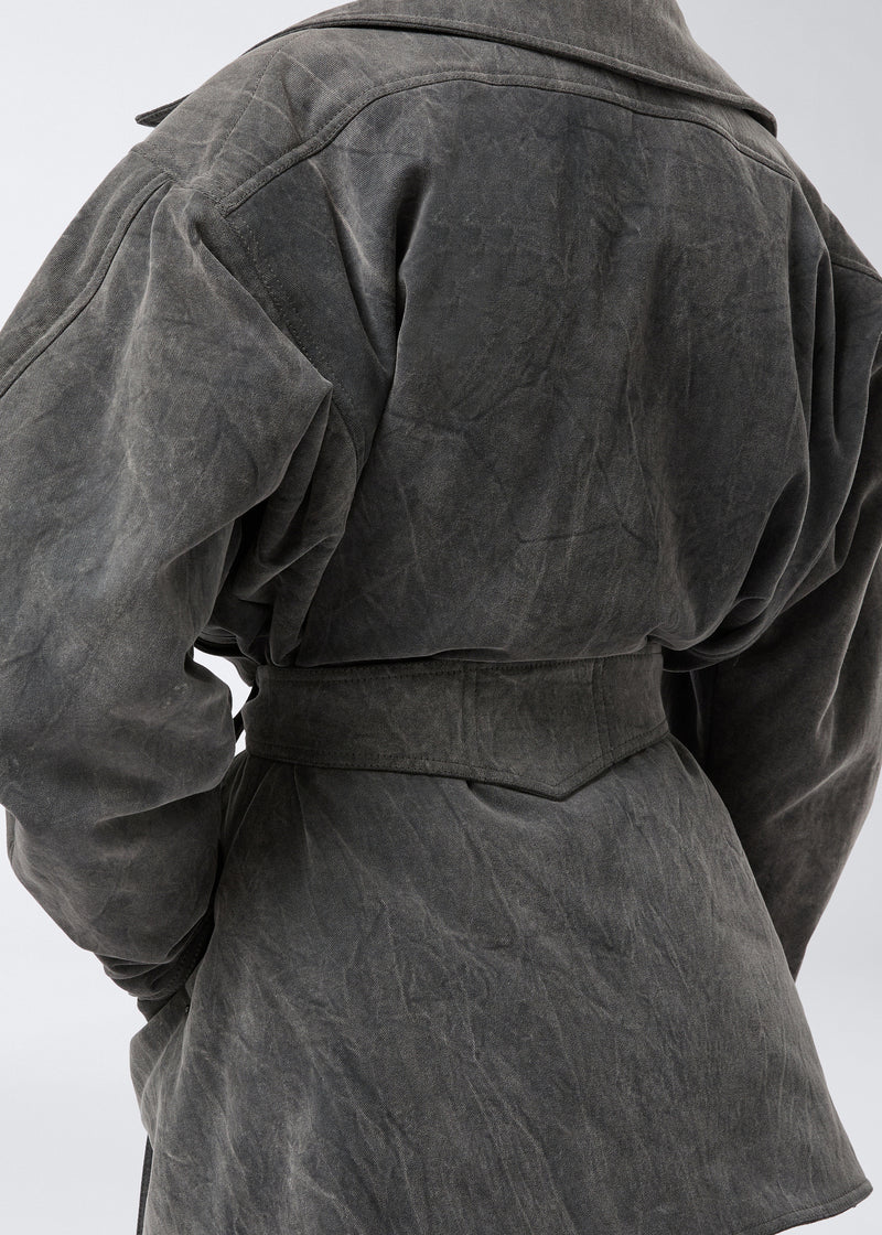 
                          Detail view shows the back of the Xandra Jacket in ardesia stone-washed cotton with an oversized collar and a sewn-on matching belt for a structured look.
                        