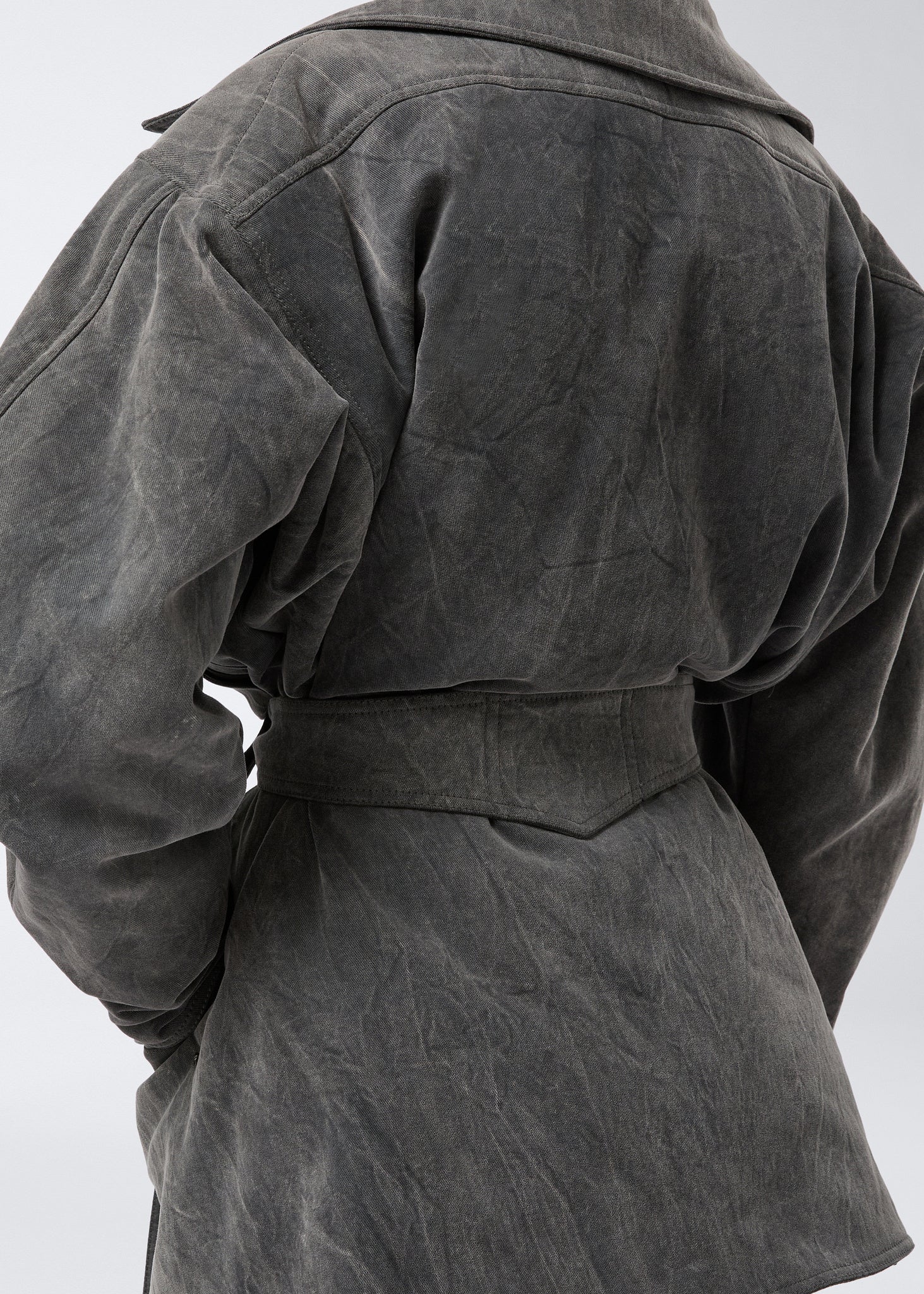 Detail view shows the back of the Xandra Jacket in ardesia stone-washed cotton with an oversized collar and a sewn-on matching belt for a structured look.