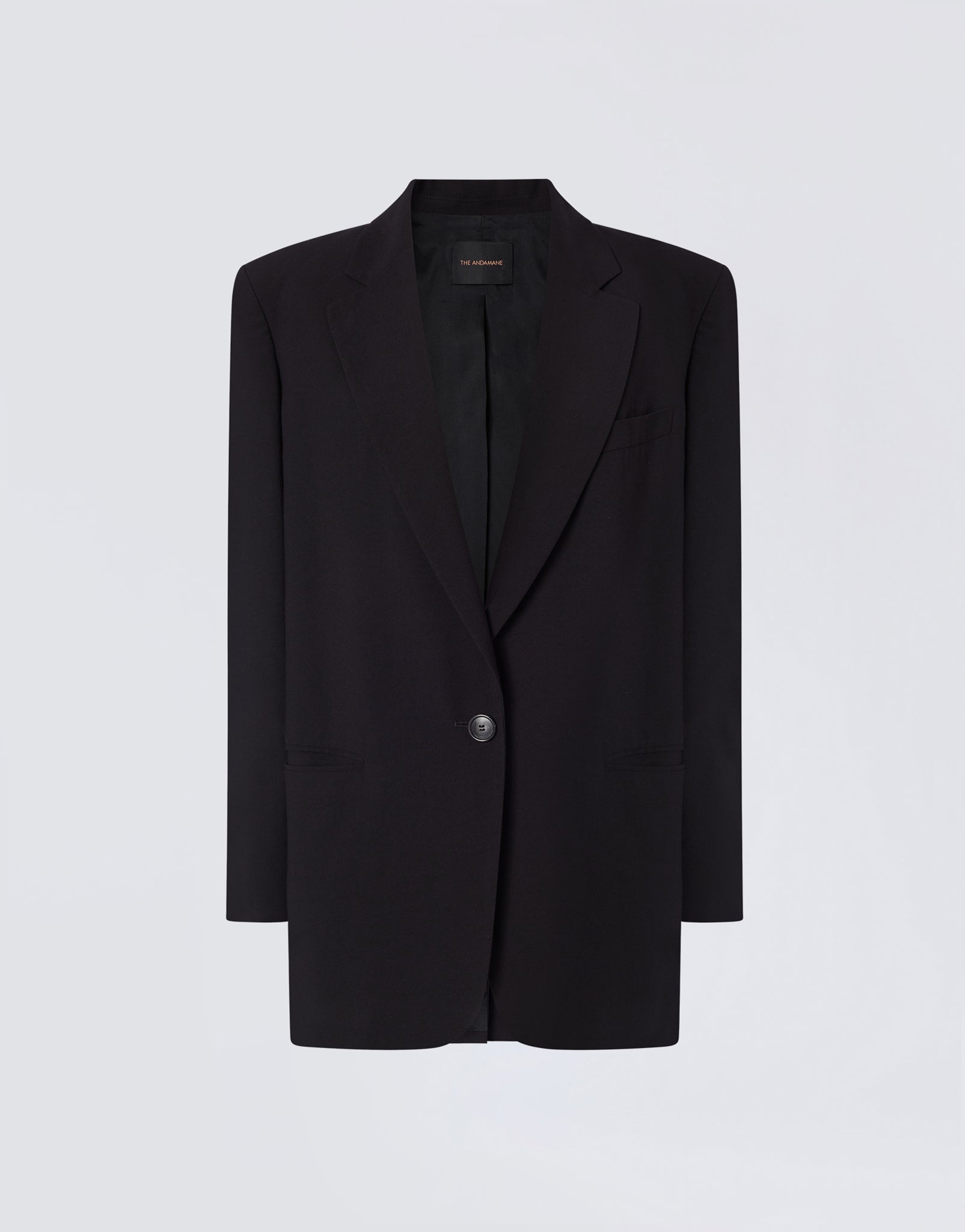 Frontal view shows Teresa Blazer in black felted wool with single-breasted button closure, peaked lapel, visible front pockets, and label reading &#39;THE ANDAMANE&#39; inside collar.