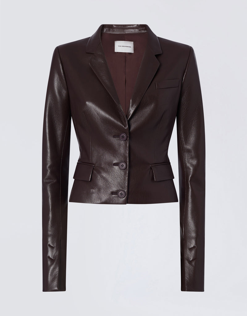 
                          Frontal view shows Zefira Blazer in cabernet vegan leather, featuring a notched lapel, three-button closure, welt pocket, and two flap waist pockets.
                        