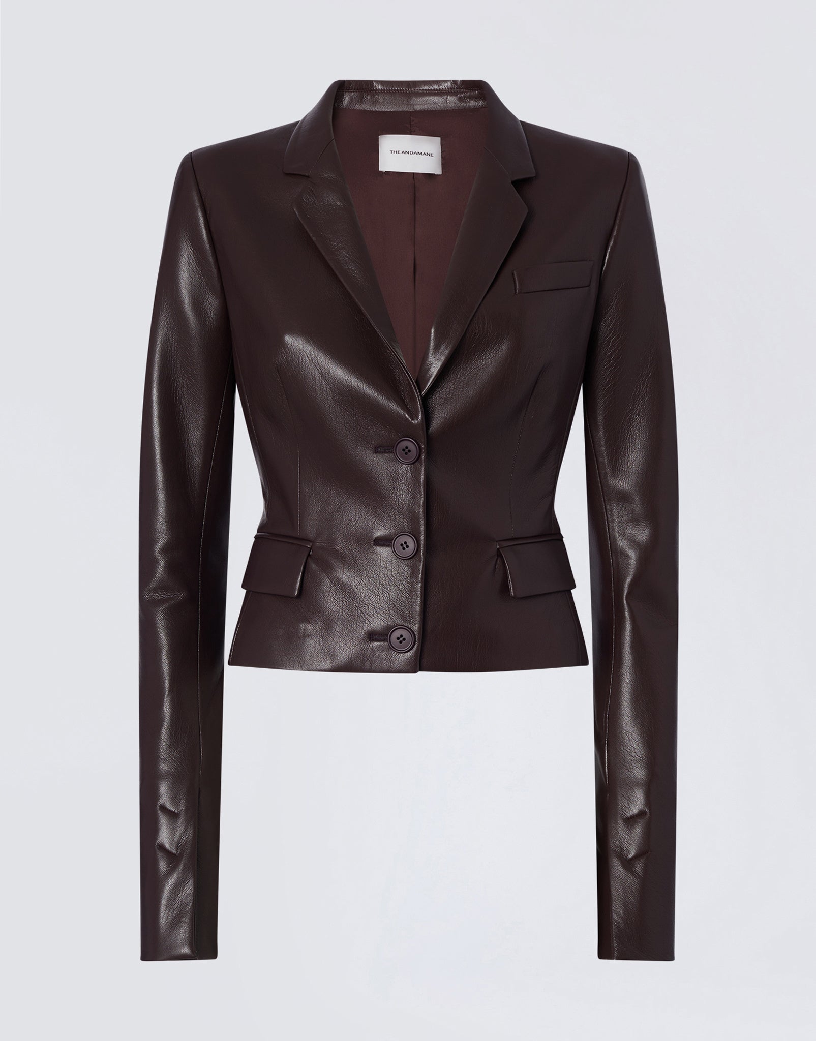 Frontal view shows Zefira Blazer in cabernet vegan leather, featuring a notched lapel, three-button closure, welt pocket, and two flap waist pockets.