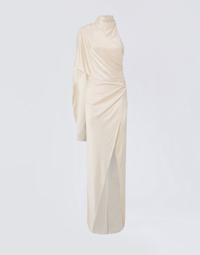 
                          Frontal view of the Waverly Maxi Dress in ivory shiny jersey, featuring a long draped cape over one shoulder, turtleneck, and floor-length slit skirt.
                        