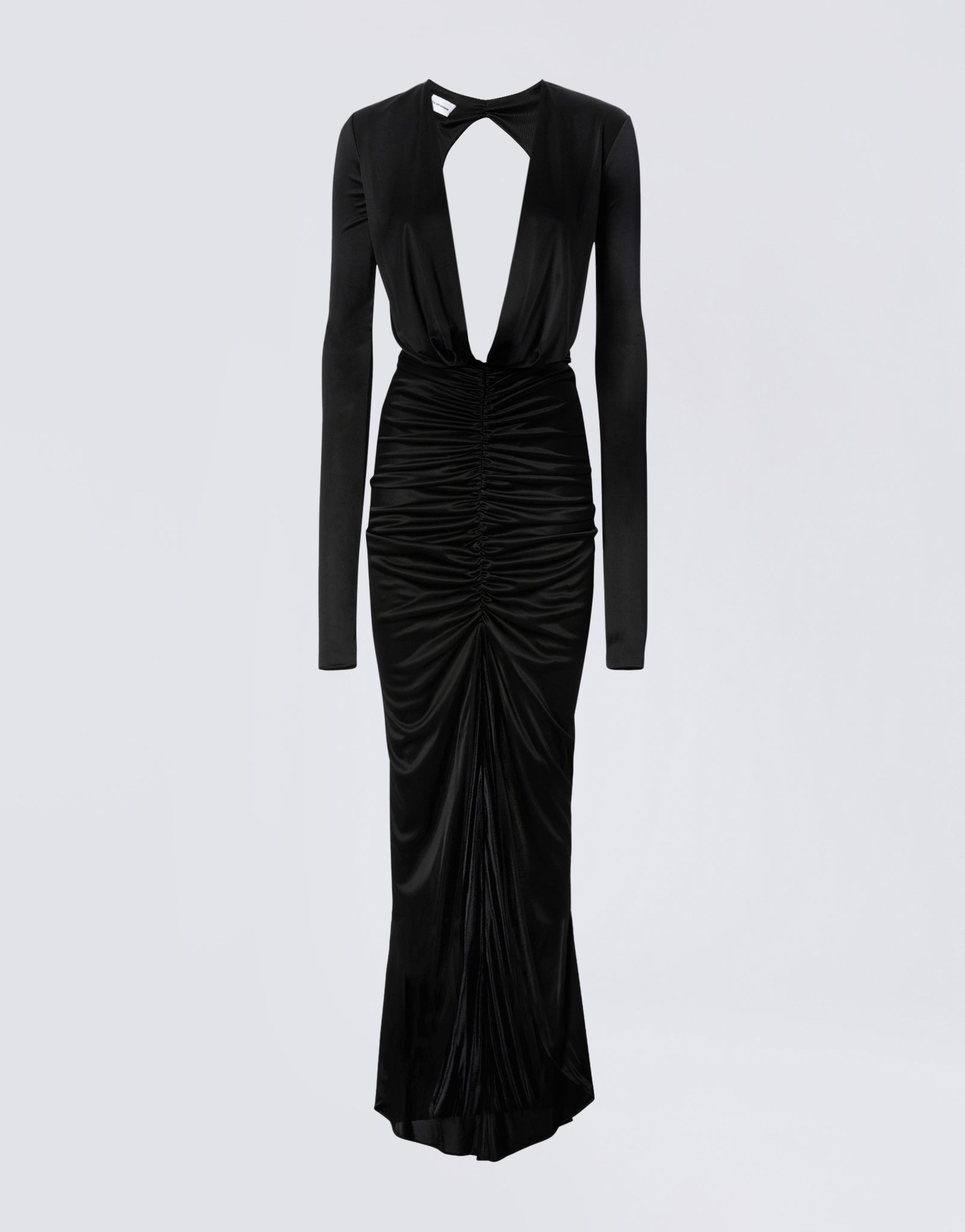 Frontal view of the Zelda Maxi Dress, a black shiny jersey gown with long sleeves, deep plunging V-neck, ruched skirt, and floor-length draped opening.