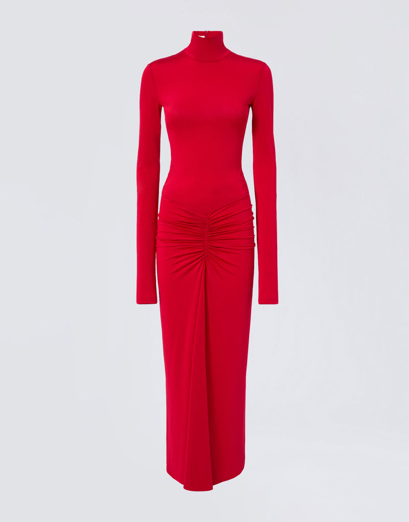 
                          Frontal view shows Warwick Maxi Dress, a red maxi dress with long sleeves, turtleneck, and ruched detailing at the waist for a mermaid-effect skirt.
                        