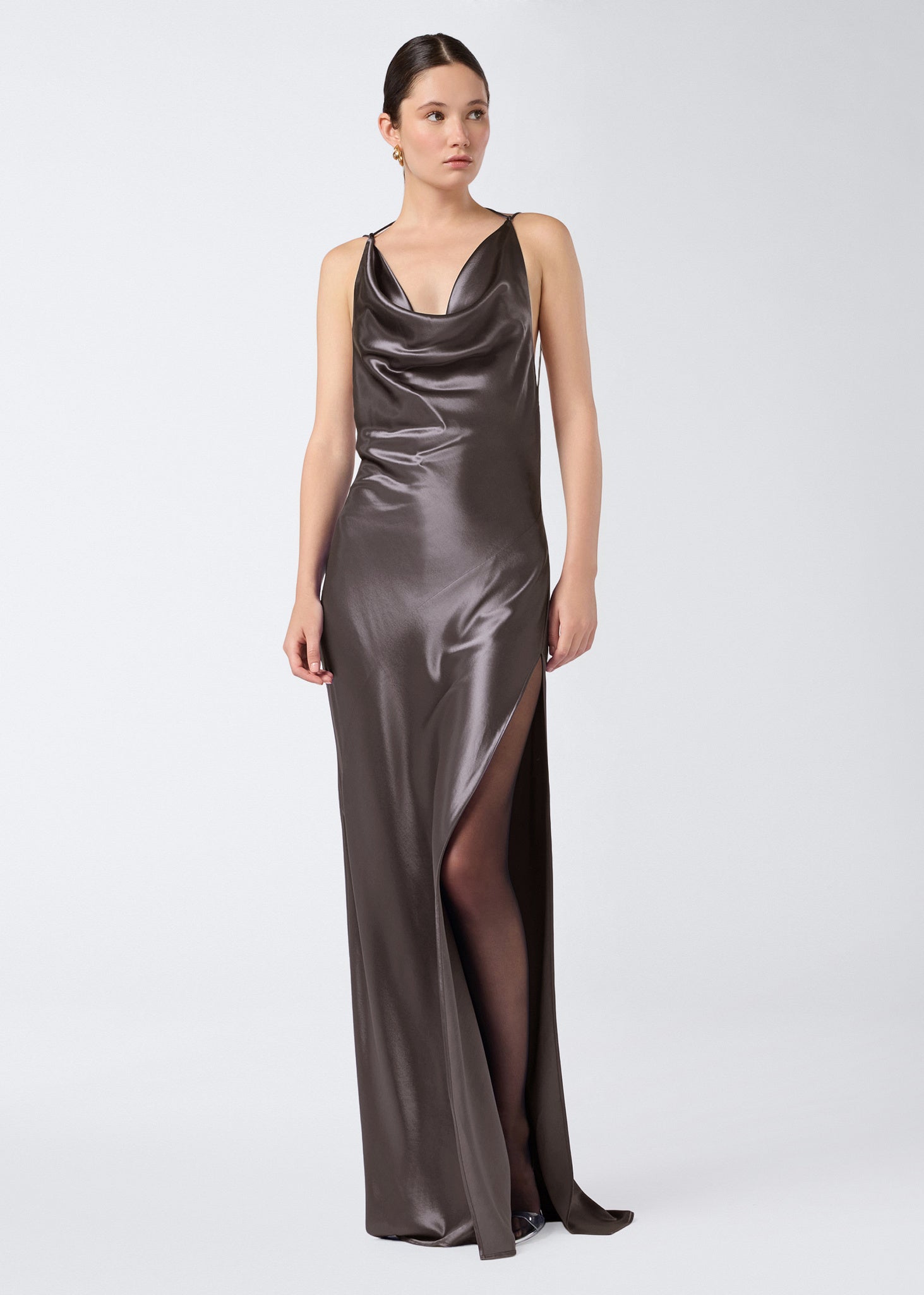 Frontal view of the Vera Maxi Dress, a steel-colored shiny satin women’s gown with a plunging cowl neck, adjustable straps, and a floor-length silhouette.