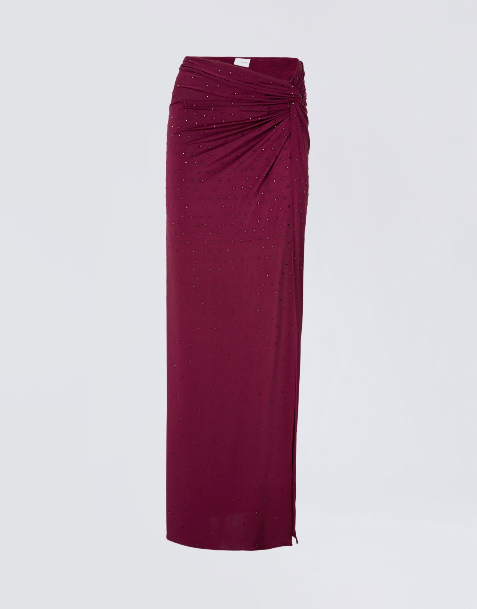 Frontal view of the Zohra Crystal Maxi Skirt, a cabernet-red jersey maxi skirt decorated with all-over crystals, featuring side knot draping and waist ruching.