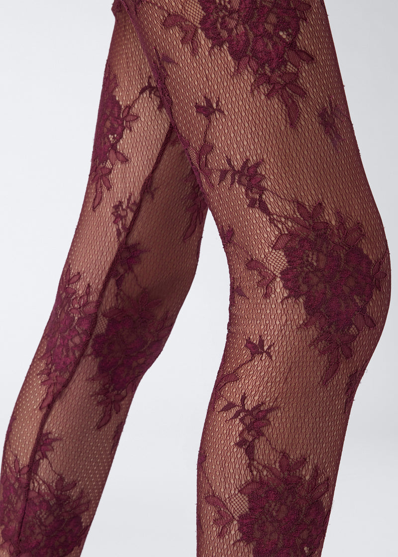 
                          Detail view shows Zillah Leggings in cabernet lace, featuring sheer floral pattern, solid trim, and full-length legs extending down to the ankles.
                        