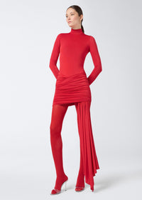 Frontal view of a model wearing the Ziggy Bodysuit, a red, long-sleeve, form-fitting jersey bodysuit with a turtleneck and sleek silhouette.
