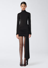 Frontal view of a model wearing the Ziggy Bodysuit in black lightweight jersey, featuring long sleeves, turtleneck, and clean lines with a sleek finish.