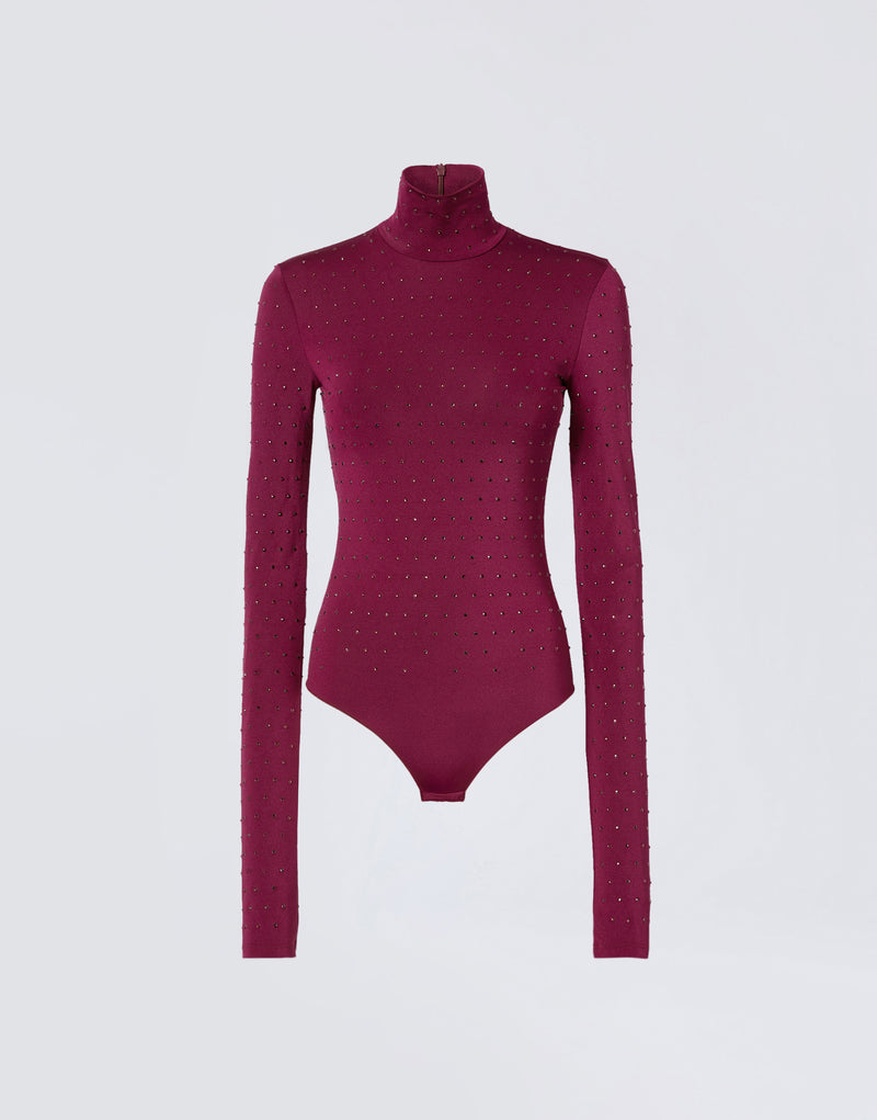
                          Frontal view of the Ziggy Bodysuit in cabernet lightweight jersey, featuring all-over crystals, long sleeves, and a turtleneck with a zip closure at the back.
                        