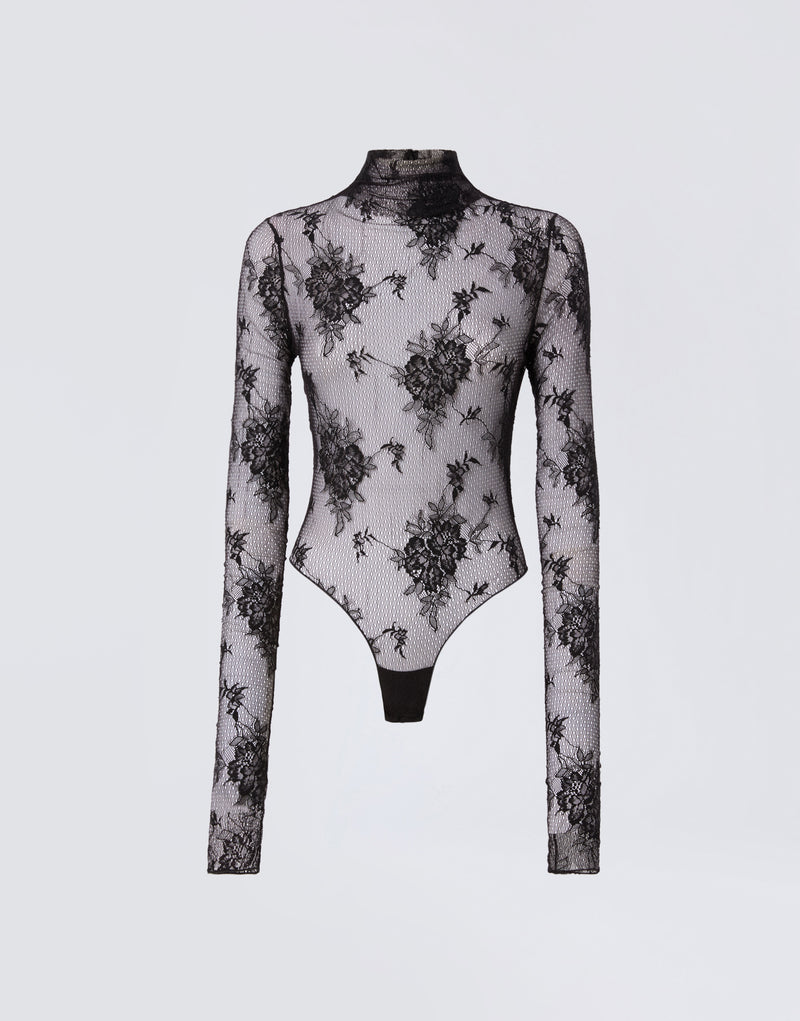 
                          Frontal view of the Ziggy Bodysuit, a sheer black lace women&#39;s bodysuit with long sleeves and a high turtleneck, featuring intricate floral patterns.
                        