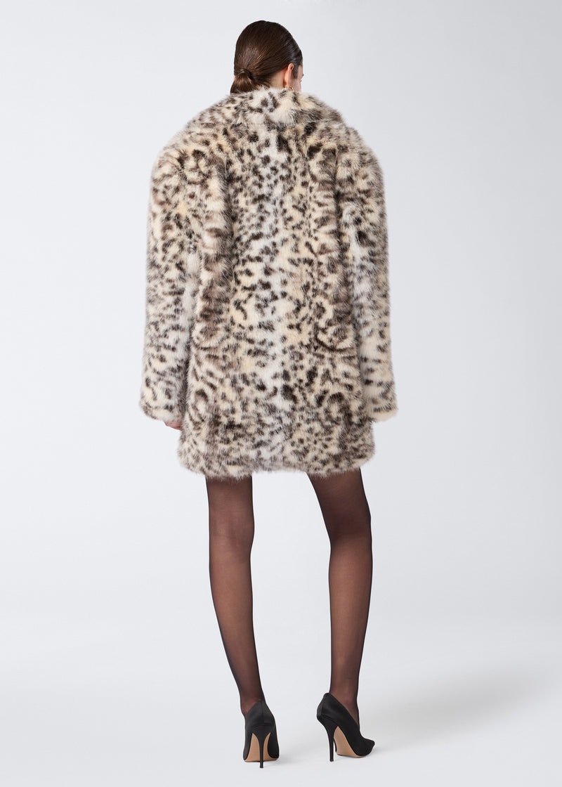 
                          Rear view of a person wearing the Weston Maxi Jacket, an animal-print faux fur women&#39;s jacket with padded shoulders extending to mid-thigh length.
                        