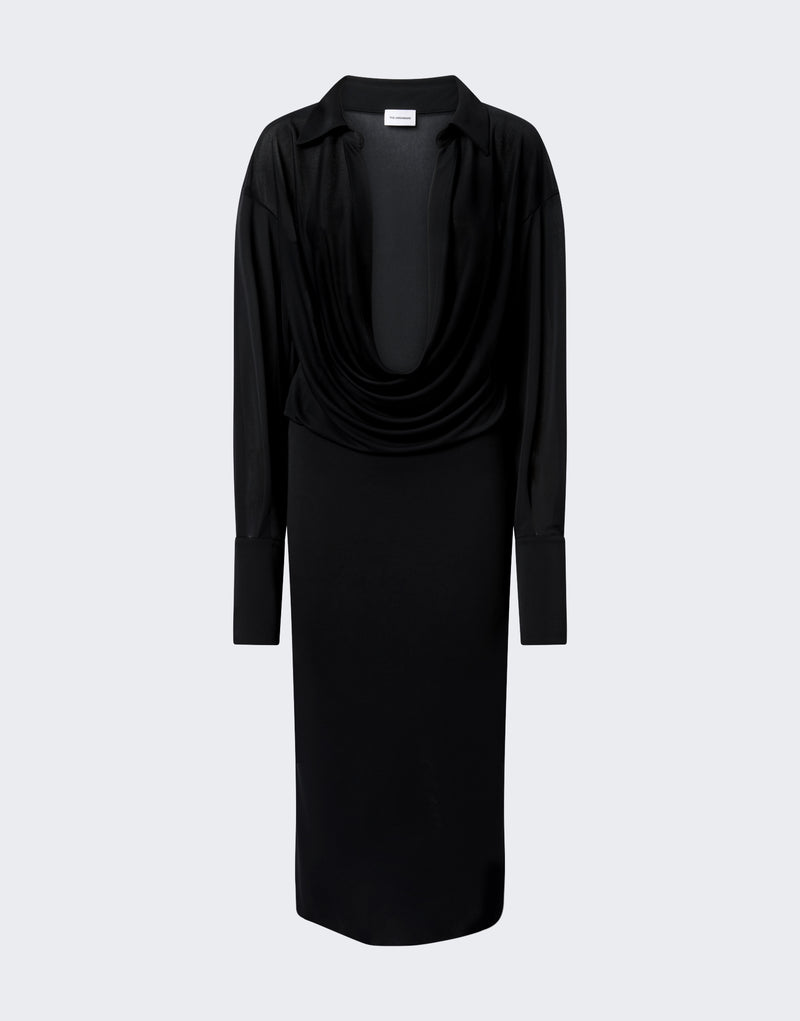 Frontal view — Lilia Midi Dress hanging against a pale gray background, black jersey chiffon drapes into a deep plunging cowl V-neck with pointed spread collar and long exaggerated single-button cuffs; label reads "THE ROW".