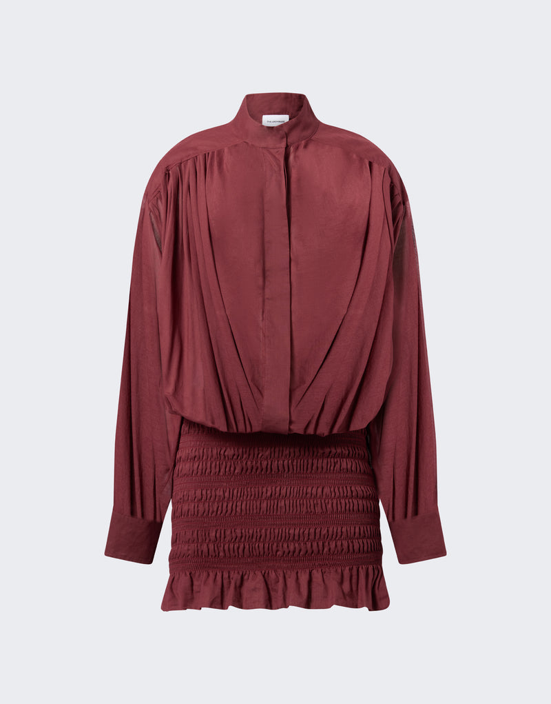 Frontal view — Rania Mini Dress shows a loose shirt-style bodice with pleated shoulders and mandarin collar, smocked mini skirt with frilled hem in rouge noir.