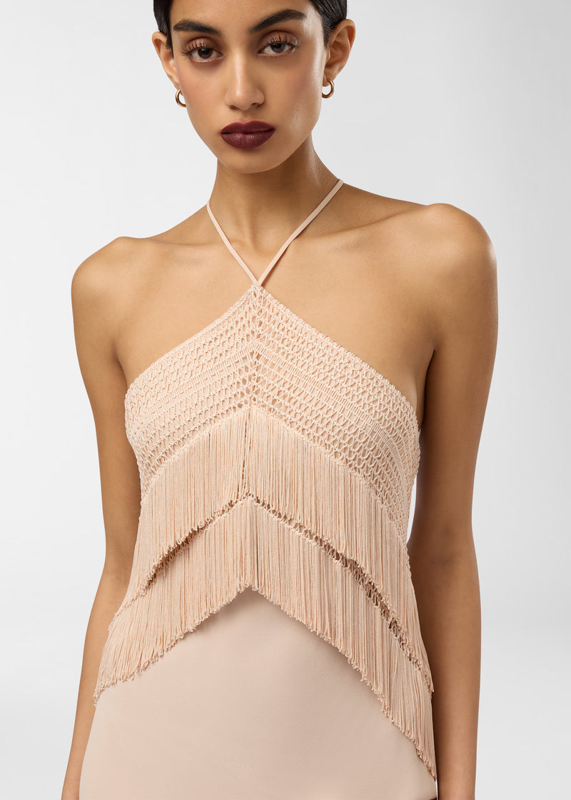 Frontal view: Reina Midi Dress shown on a model, featuring a bandeau bodice with thin halter tie, openwork stitching and layered peach fringe over crepe de chine.