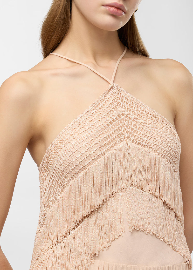 Frontal view: Reina Top worn by model, displaying a peach crepe de chine bandeau with thin halter tiebacks, openwork stitching, and multi-layered fringe.