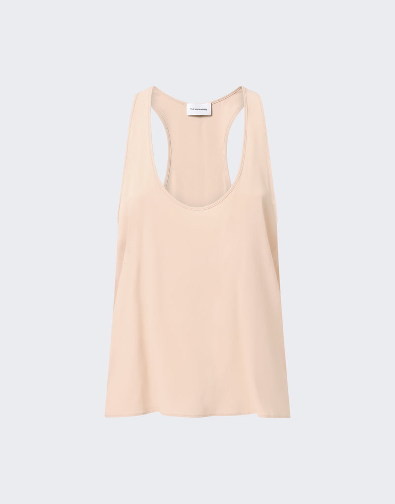 Frontal view of Pura Top: peach crepe de chine tank with scooped neckline and racerback, draping softly on a light gray background; label reads 'THE ANDAMANE'.