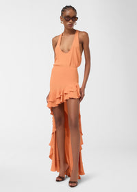 Frontal view: Pura Top — tangerine crepe de chine tank top drapes on model, scooped neckline and racerback frame the shoulders as fabric flows fluidly down the bodice.
