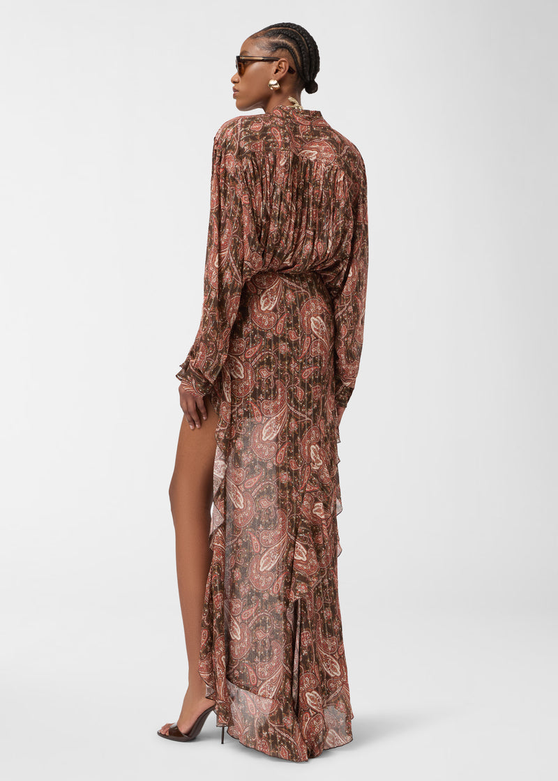 Rear view — Rania Shirt: model wears an oversized paisley-printed georgette shirt with pleated shoulder and back yoke, standing in profile against a plain white background.